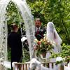 outdoor wedding at my trout pond. Radiant Touch provided floral, trellis, tulle, canopy, tables and chairs plus photography. Oregon wedding officiant minister in Oregon City
