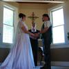 Bell Tower chapel wedding. Bride wore a gown and riding boots. Groom wore dew rag, chaps and Harley Davidson vest. Great photos of bride on motorcycle! Oregon wedding minister officiant Portland Oregon. ceremony and full photography by Radiant Touch Weddings