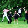 Enchanted Elopement photo of guests jumping in the air