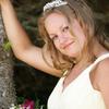 Beautiful bride wearing a tiara and light yellow dress