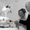 bride and groom cutting the cake. red rose