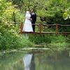 bride and groom reflection in water