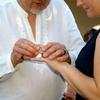 backyard wedding at a Vancouver Washington home. placing ring on finger