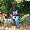 Jamaica man carving wood